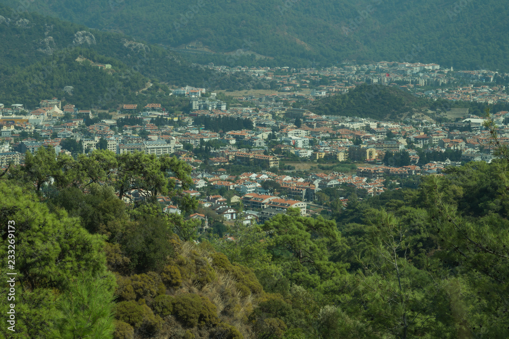 Mountain town panoramic view. city between the hills
