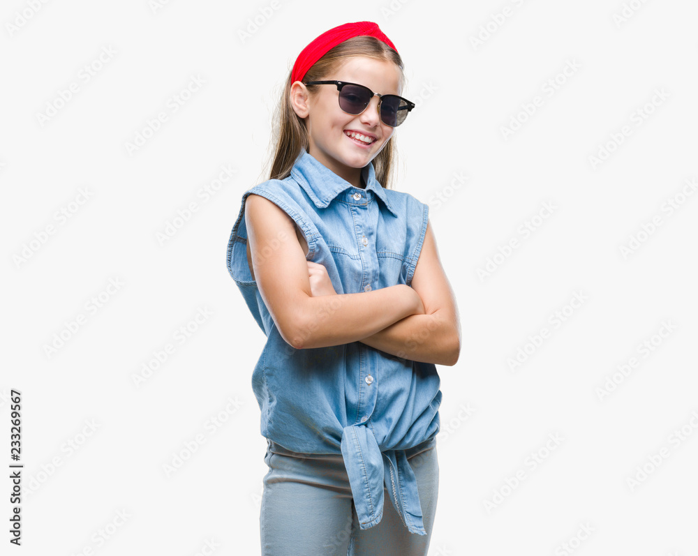 Young beautiful girl wearing sunglasses over isolated background happy face smiling with crossed arms looking at the camera. Positive person.