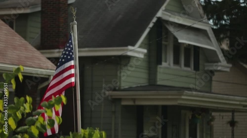 American flag flying in old neighborhood photo