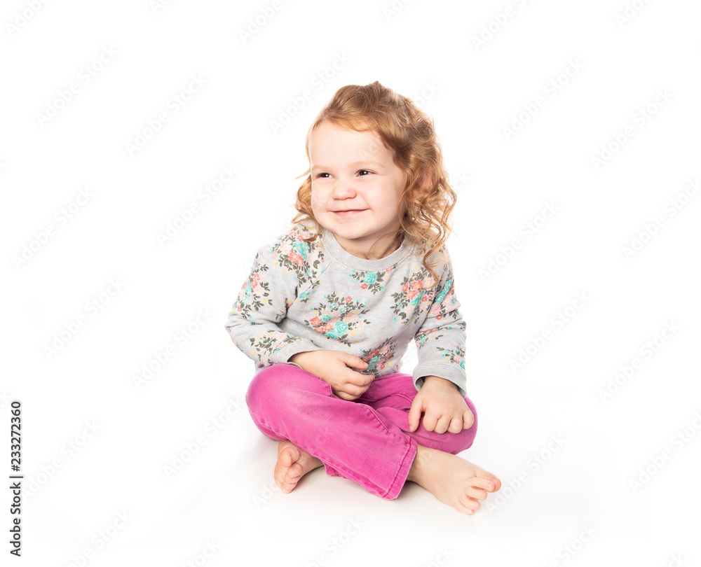 A cute Little Girl with redhead in studio white background A cute Little Girl with redhead in studio white background