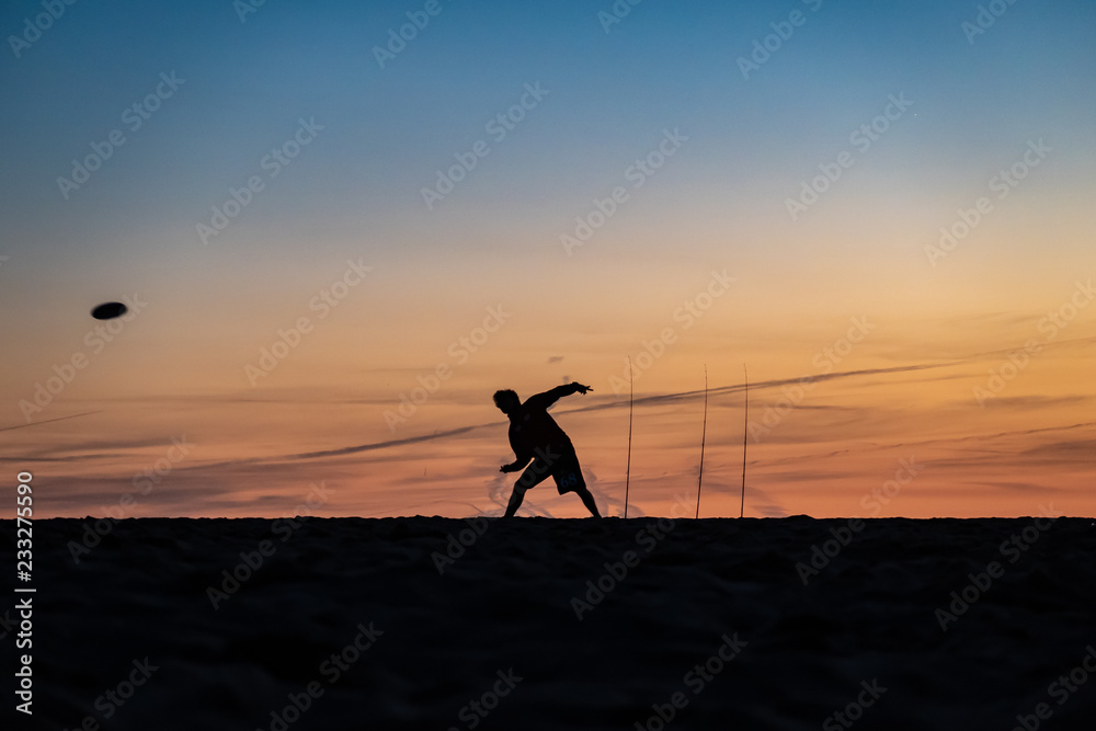 Frisbee player at sunset