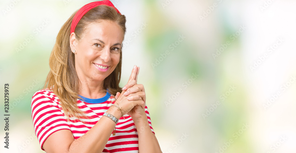 Beautiful middle age woman wearing casual stripes t-shirt over isolated background Holding symbolic gun with hand gesture, playing killing shooting weapons, angry face Beautiful middle age woman wearing casual stripes t-shirt over isolated background Holding symbolic gun with hand gesture, playing killing shooting weapons, angry face