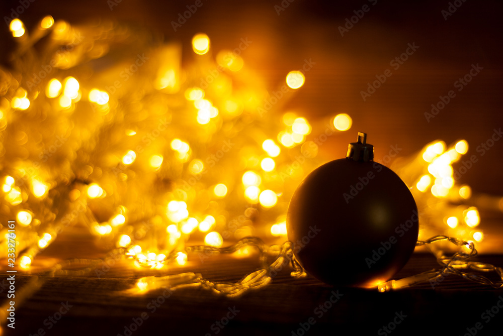 Abstract Christmas warm light celebration bokeh background with de focused lights and decorative bauble.