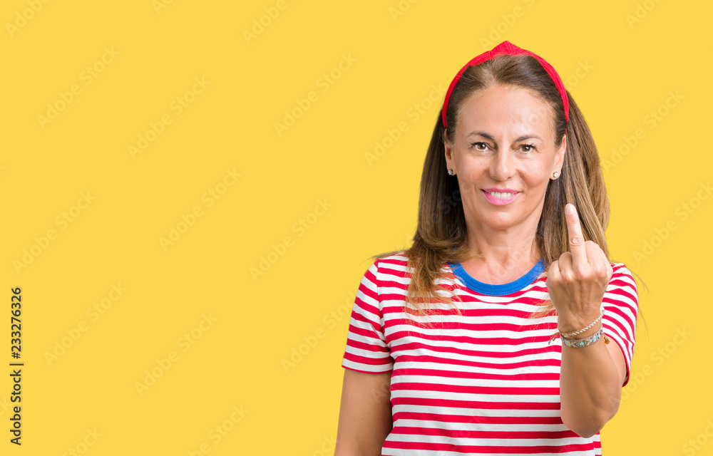 Beautiful middle age woman wearing casual stripes t-shirt over isolated background Showing middle finger, impolite and rude fuck off expression Beautiful middle age woman wearing casual stripes t-shirt over isolated background Showing middle finger, impolite and rude fuck off expression