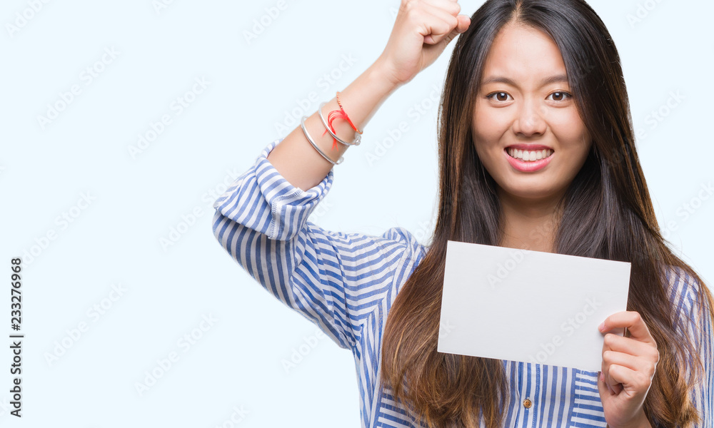 Young asian woman holding blank card over isolated background annoyed and frustrated shouting with anger, crazy and yelling with raised hand, anger concept Young asian woman holding blank card over isolated background annoyed and frustrated shouting with anger, crazy and yelling with raised hand, anger concept