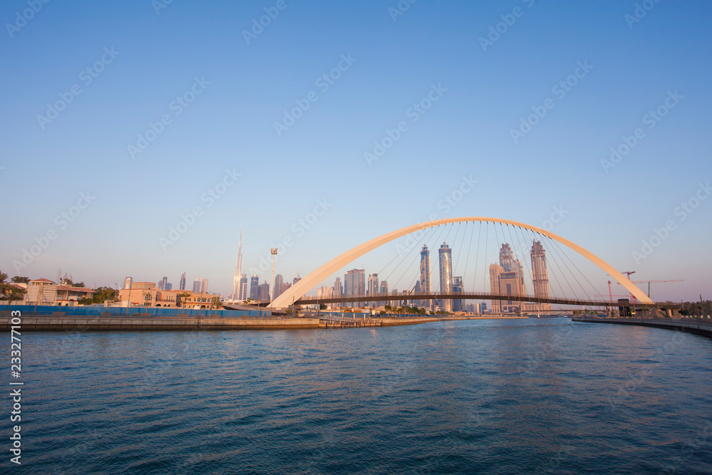 Dubai city skyline at sunset. view of Tolerance bridge