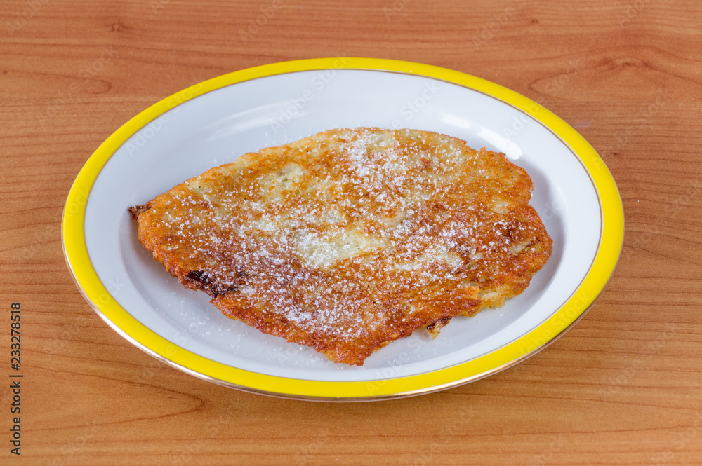 Polish placki ziemniaczane with sugar. Potato pancakes, latkes, deruny or boxties Polish placki ziemniaczane with sugar. Potato pancakes, latkes, deruny or boxties