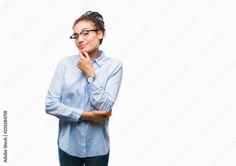 Young braided hair african american business girl wearing glasses over isolated background looking confident at the camera with smile with crossed arms and hand raised on chin. Thinking positive. Young braided hair african american business girl wearing glasses over isolated background looking confident at the camera with smile with crossed arms and hand raised on chin. Thinking positive.