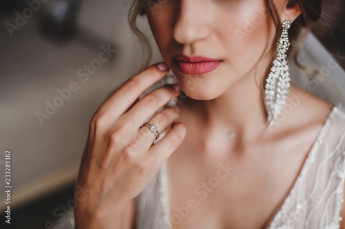 Wedding ring on the bride's hand.