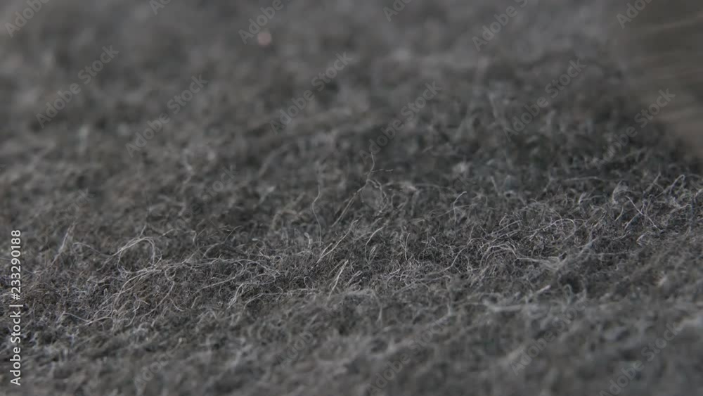 A man vacuums the car interior, macro