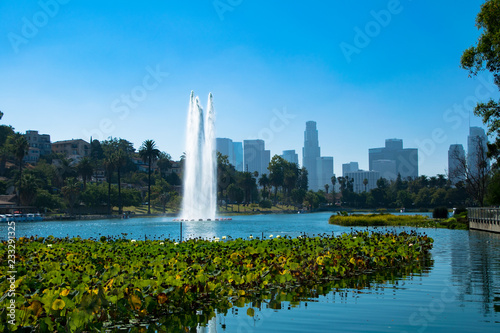 The fountain at Echo Park in Los Angeles, California with the downtown skyline in the background
