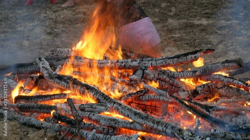 young girl falls in firetime jump over fire during Slavic celebrations of Ivana Kupala. bonfires in ritual test of bravery and faith, accident, burns young girl falls in firetime jump over fire during Slavic celebrations of Ivana Kupala. bonfires in ritual test of bravery and faith, accident, burns