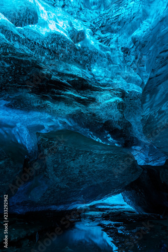 Ice Caves or Crystal Caves in Icelandic glaciers are a truly mesmerizing wonder of nature. The blue-glazed glacier blows away and creates amazing caves. Running water and black sand...