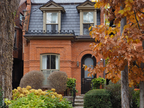 Photography old brick house with slate mansard roof