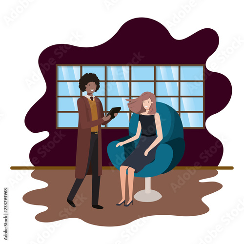 woman sitting in chair and man with tablet