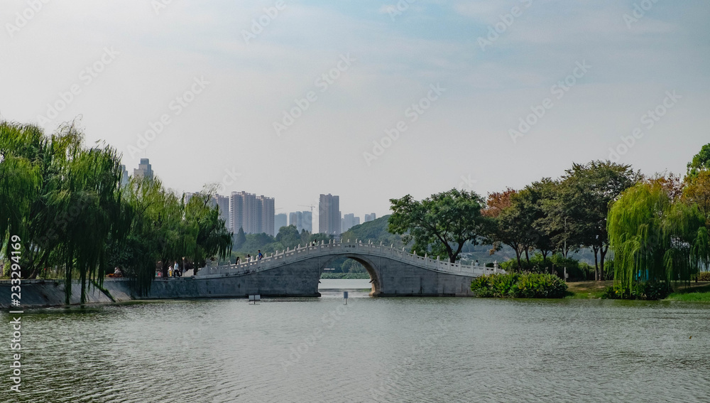 Arch bridge in park of wuhan garden. Wuhan, Hubei China.