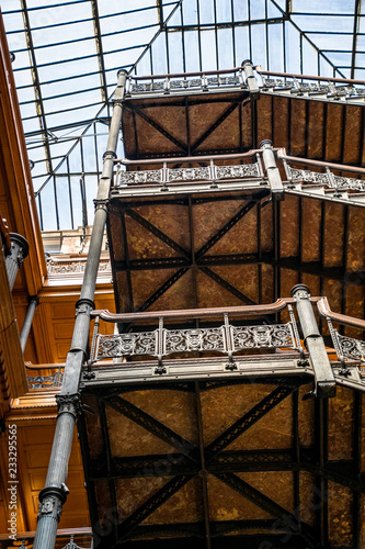 The iron, wood and glass of the Chicago School architecture of the Bradbury Building in downtown Los Angeles, California