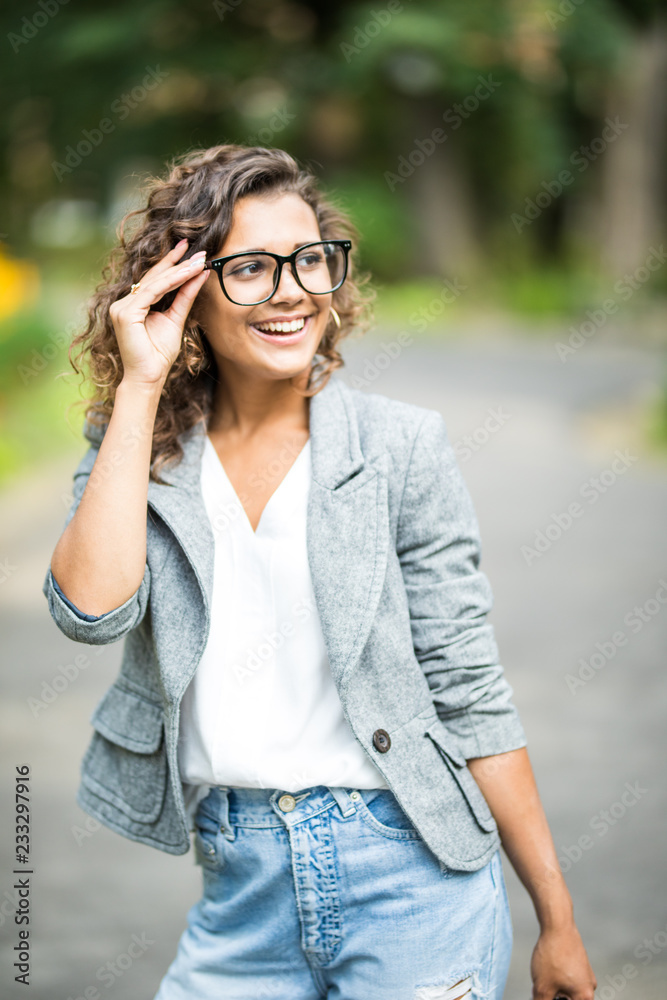 Young Woman with Glasses Out in the City. Beautiful young woman with glasses out in the city Young Woman with Glasses Out in the City. Beautiful young woman with glasses out in the city
