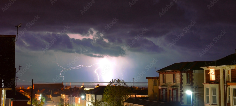 Lightning Storm Over Bay and Rooftops
