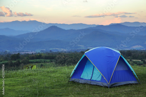 Outdoor camping tent among meadow on mountain during sunset at Yun Lai Viewpoint, Pai town , Mae Hong Son in Thailand. This is very popular for photographers and tourists.Travel and natural Concept © goodze