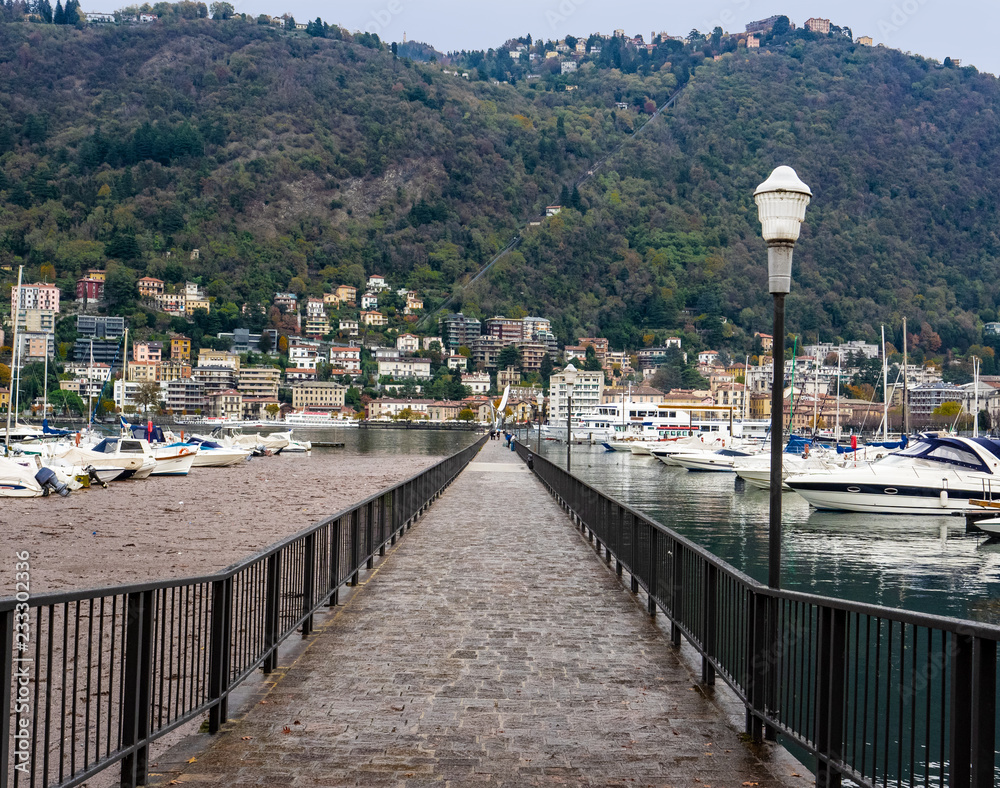pedestrian promenade overlooking the city, through the port of Como