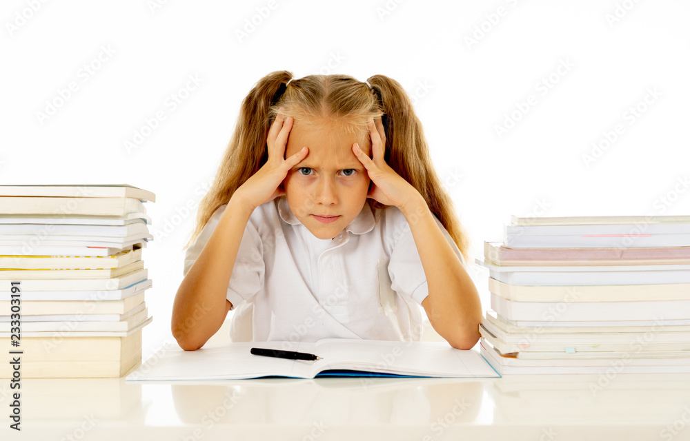 Sad unhappy cute little girl overwhelm with homework and studies Sad unhappy cute little girl overwhelm with homework and studies