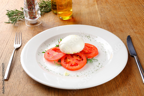 Mozzarella tomatoes and basil