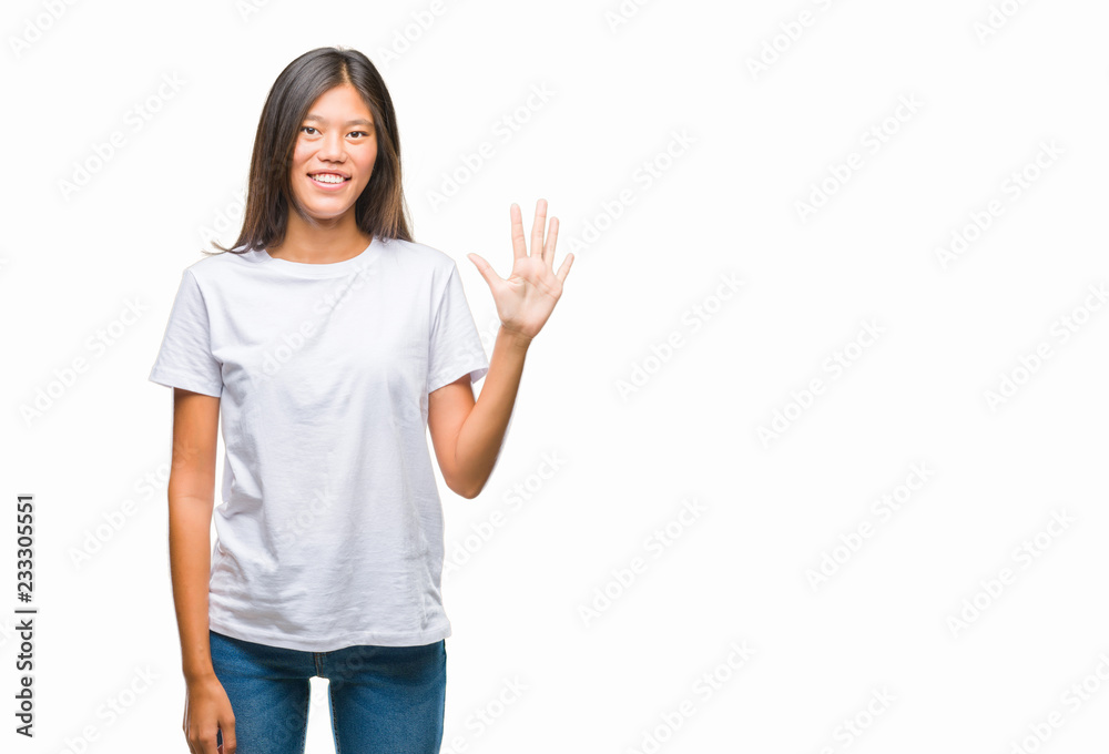 Young asian woman over isolated background showing and pointing up with fingers number five while smiling confident and happy. Young asian woman over isolated background showing and pointing up with fingers number five while smiling confident and happy.