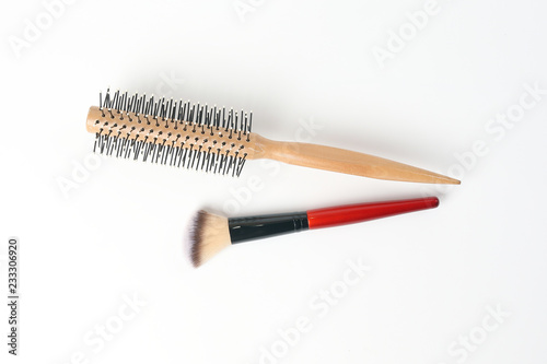 Red black makeup wooden hair brush comb beauty accessories on white background