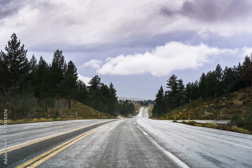 Travelling on the freeway through the Eastern Sierra mountains close to the June Lake area, Mono County, California Travelling on the freeway through the Eastern Sierra mountains close to the June Lake area, Mono County, California