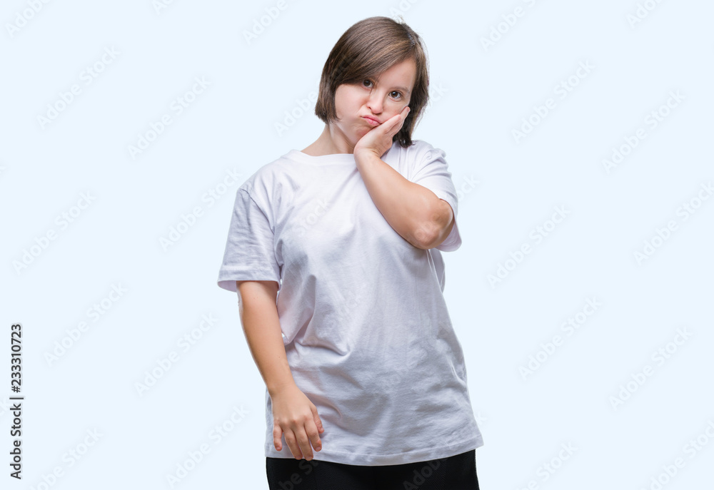Young adult woman with down syndrome over isolated background thinking looking tired and bored with depression problems with crossed arms. Young adult woman with down syndrome over isolated background thinking looking tired and bored with depression problems with crossed arms.