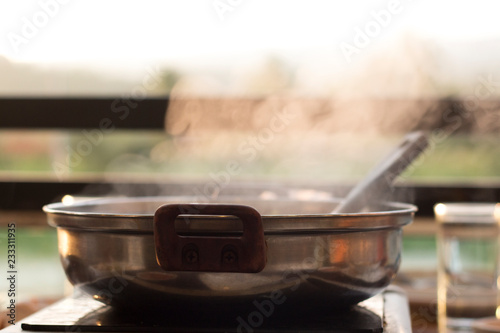 Steam rising of a boiling pot