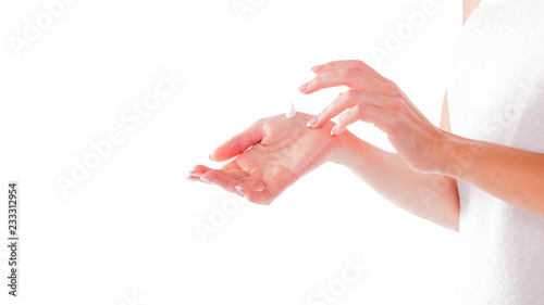 Hands with cream isolated on white. Woman apply cream.