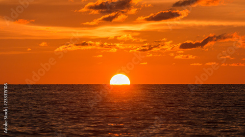 Fototapeta Naklejka Na Ścianę i Meble -  Horizon view angle of Sunset sun down moment at beach
