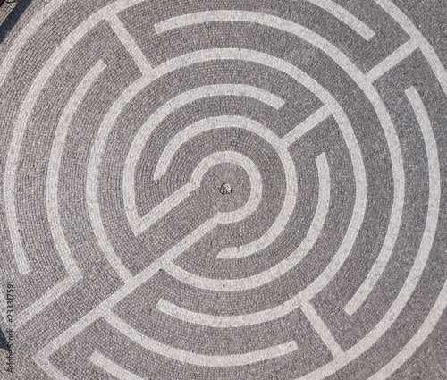 Picture of the maze on the road top view. Decorative labyrinth in the yard.