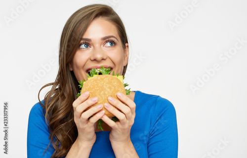 Smiling woman holding cheeseburger isolated portrait