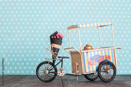 Foto ice cream cart on wheels with bunch of flowers