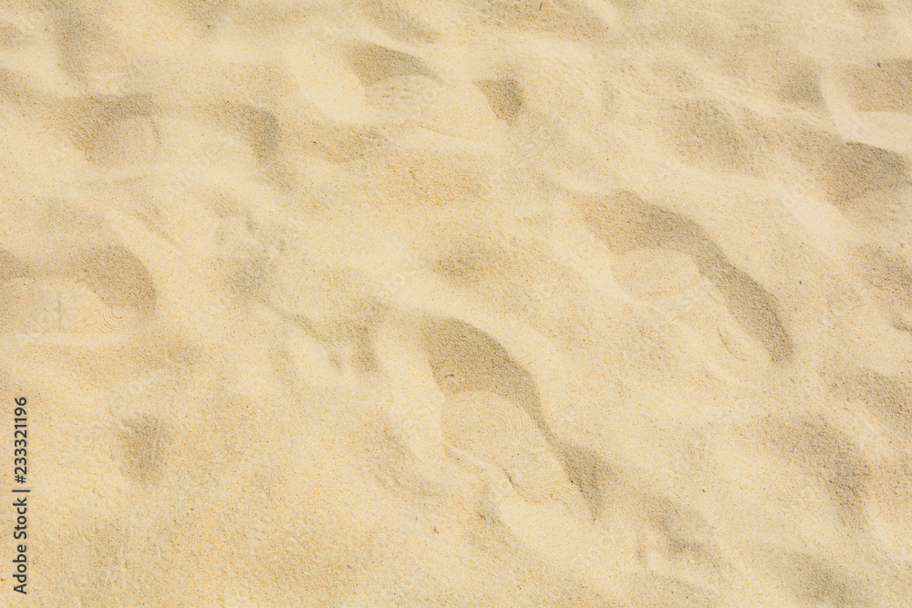 Sand texture on the beach as background.