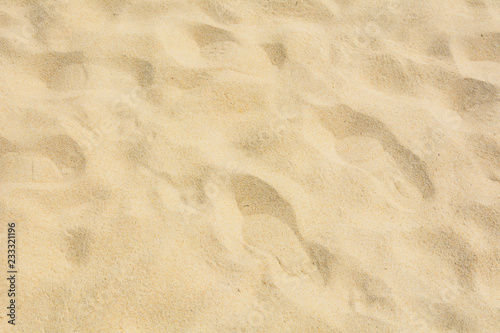 Sand texture on the beach as background.