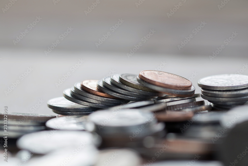 Row of coins on wood background for finance and Saving concept,Investment, Economy, Soft focus and dark style. Row of coins on wood background for finance and Saving concept,Investment, Economy, Soft focus and dark style.
