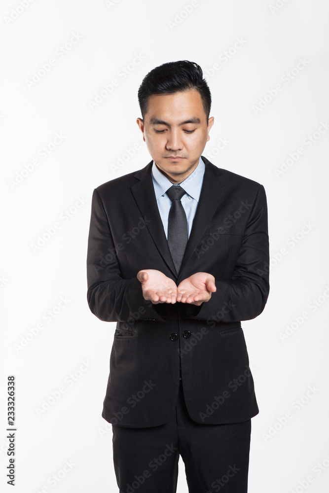 Asian man in business suit put his hand together, holding concept Asian man in business suit put his hand together, holding concept