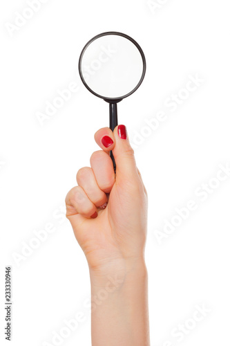 Magnifier glass in woman hand isolated on white background