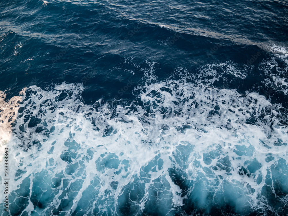 Wake on blue sea surface