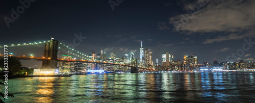 Beautiful Brooklyn Bridge on the background of the night New York cityscape