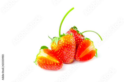 fresh red strawberry isolated full and half on white background and clipping path. The name of science : Fragaria x ananassa Duchesne