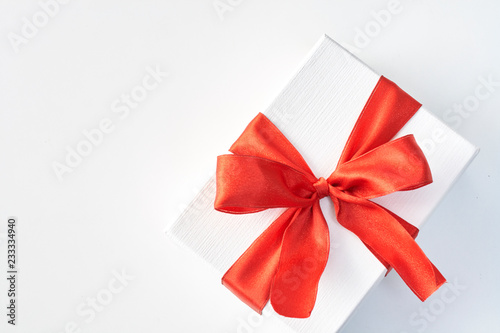 Gift box with red ribbon