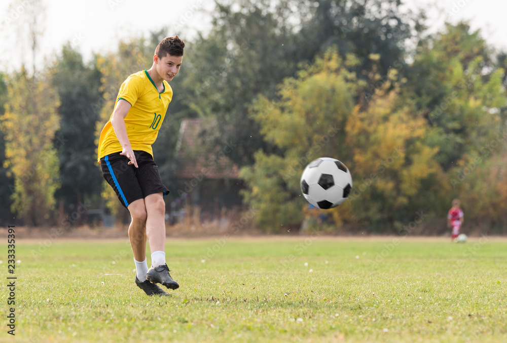Young children player on the football match Young children player on the football match