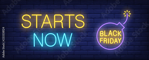 Starts now neon text and bomb with lit fuse. Offer and sale advertisement design. Night bright neon sign, colorful billboard, light banner. Vector illustration in neon style.