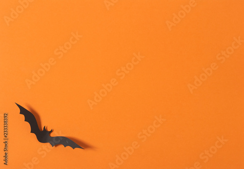 Halloween greeting card design, Paper Bats flying on orange background