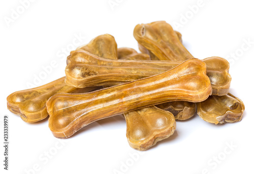 Fototapeta Naklejka Na Ścianę i Meble -  Artificial dog chew bone food with vitamins isolated on white background